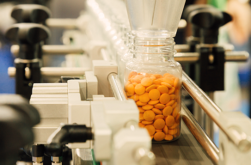 Bottle of pills in a manufacturing line